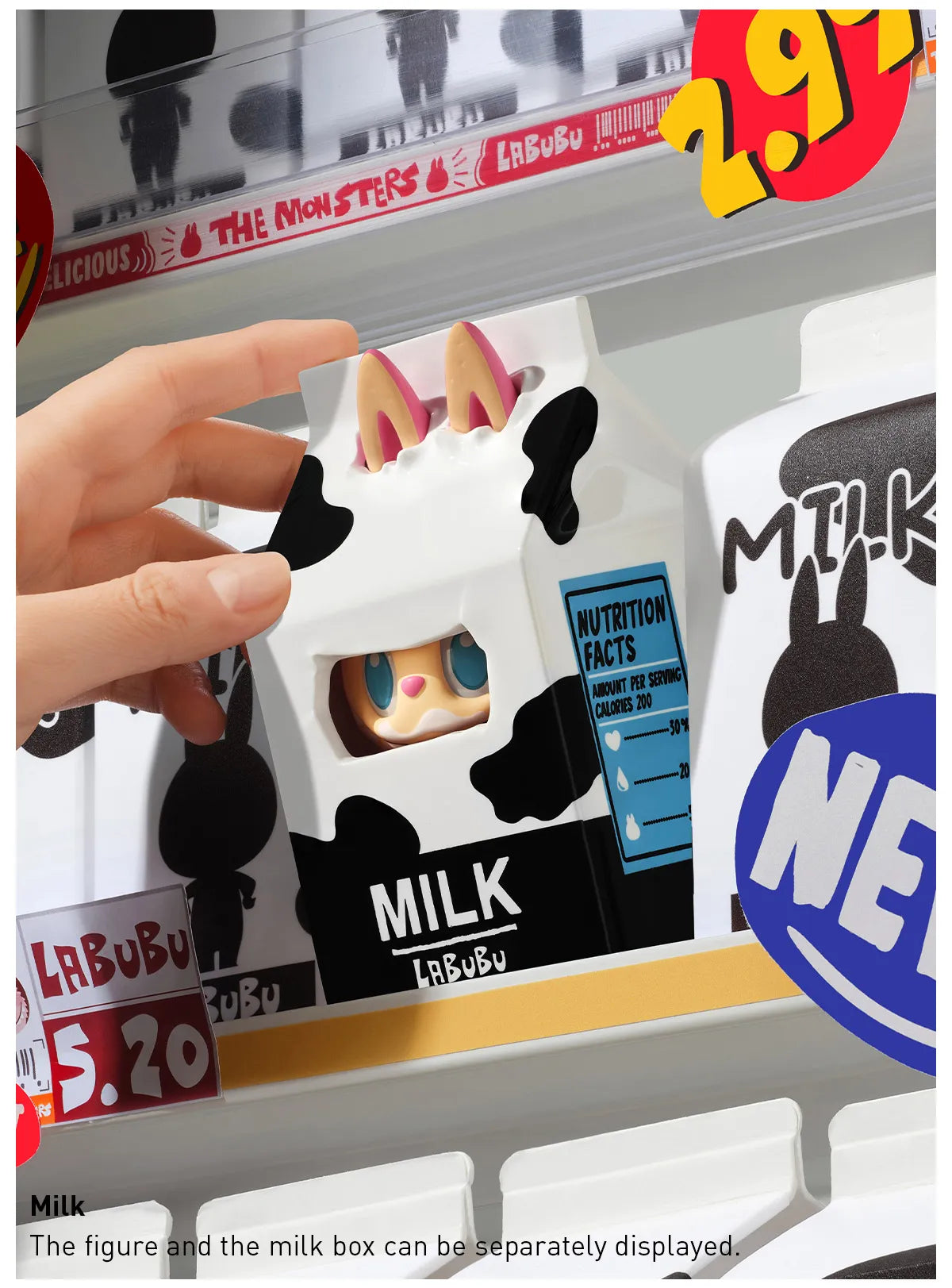 Toy figure in a milk box packaging with a hand interacting with it, displayed on a shelf. Collectible Labubu pop mart toys