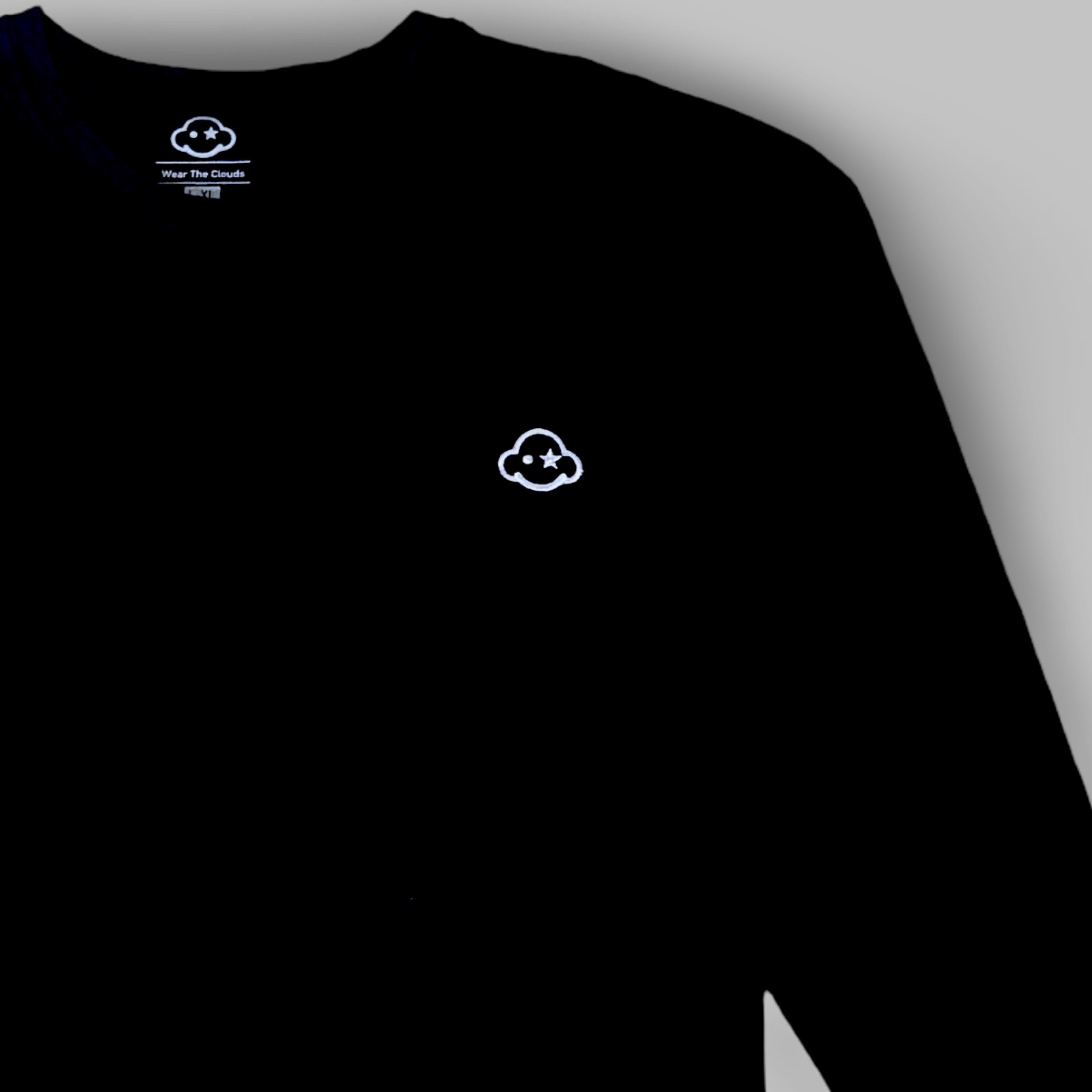 A black long sleeve cotton t-shirt with a small white logo on the left chest area. White cotton activewear pants with a small black logo on the left leg, featuring a relaxed fit and drawstring waist. 100% Cotton available in Dubai same day delivery best of summer and winter casual streetwear unisex men and women shorts and t-shirts available in UAE fast delivery and same day delivery available Pants joggers jogger pants