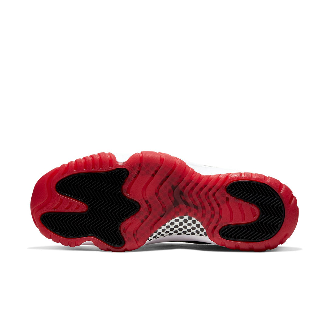 Red and black sole of a sneaker on a white background. Nike shoes Jordans dunks