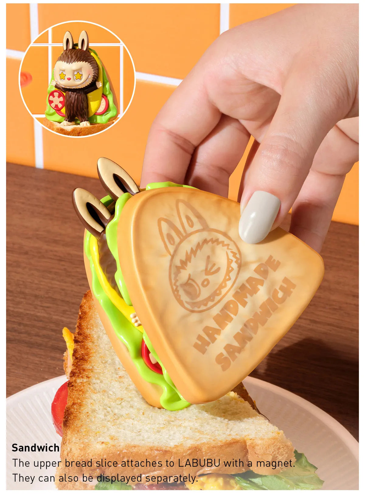 Handmade cookie shaped like a sandwich with a hand holding it, on a wooden surface. Collectible Labubu pop mart toys