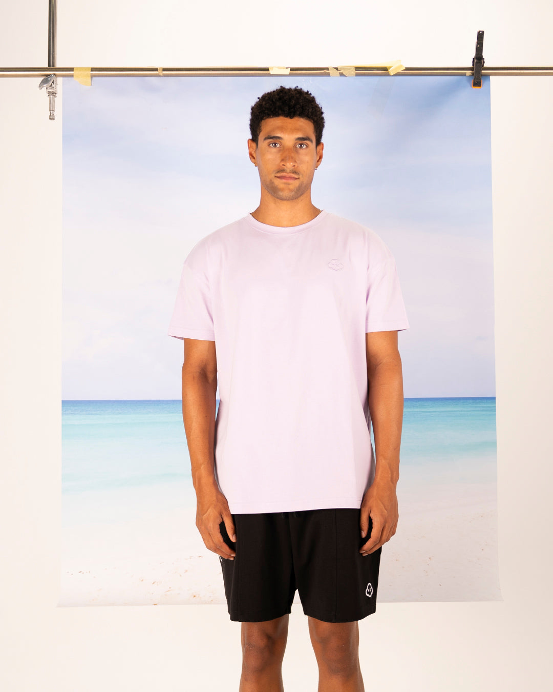 White cotton activewear pants with a small black logo on the left leg, featuring a relaxed fit and drawstring waist. 100% Cotton available in Dubai same day delivery best of summer and winter casual streetwear unisex men and women shorts and t-shirts available in UAE fast delivery and same day delivery available Pants joggers jogger pants