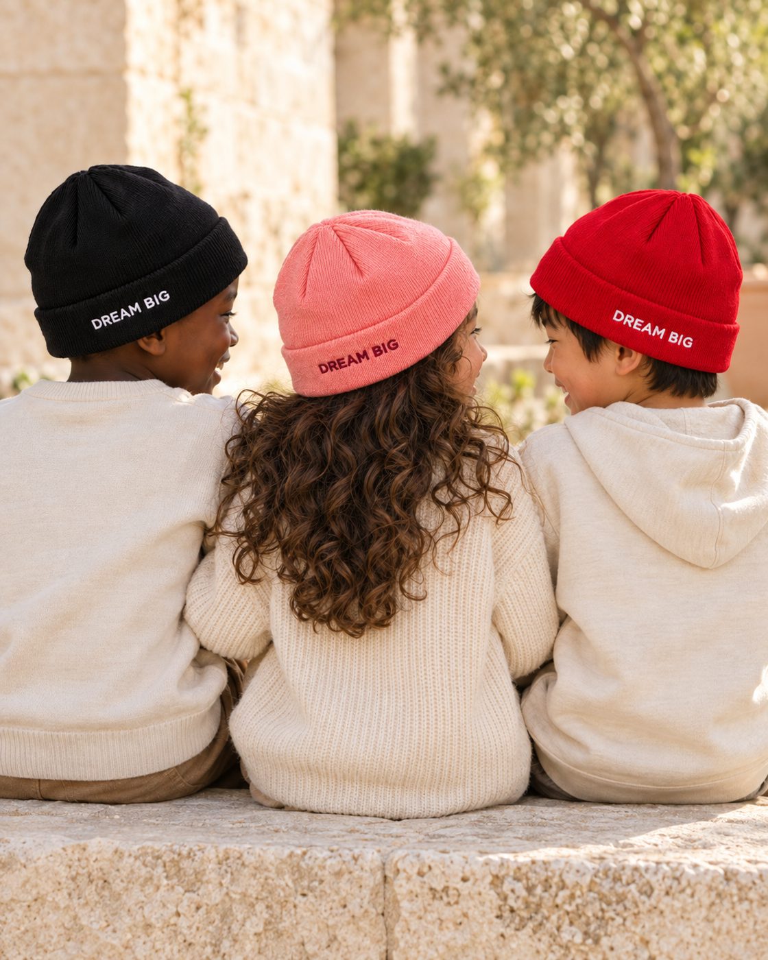 Kids from behind, DREAM BIG on the back of each beanie