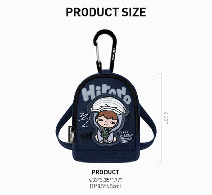 Small backpack with cartoon character and carabiner, labeled &