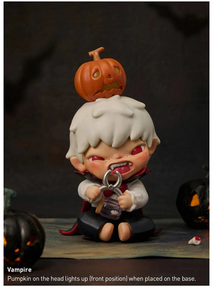 Vampire figurine with a pumpkin on its head against a dark background. Collectible Labubu pop mart toys Hirono Mini Figues