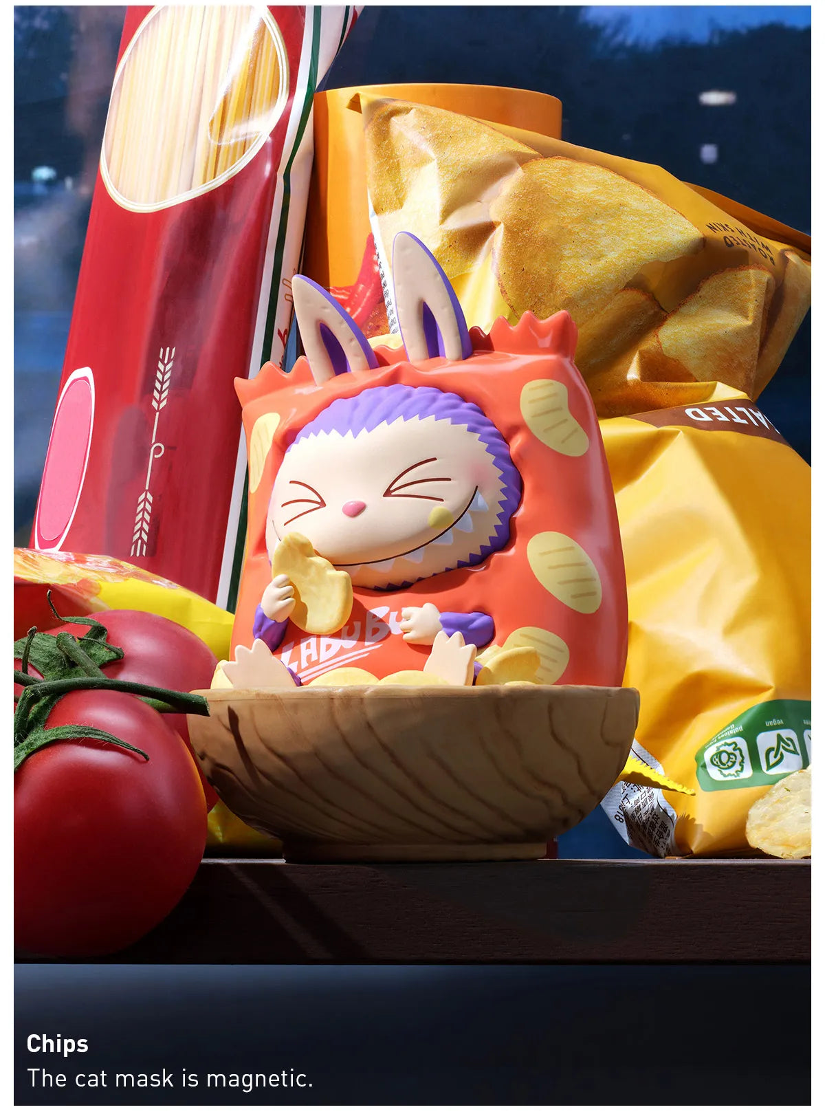 Animated cat mask with rabbit ears eating chips, surrounded by snacks and vegetables.  Collectible Labubu pop mart toys