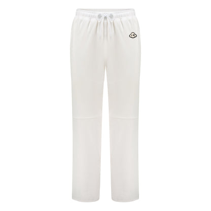 White cotton activewear pants with a small black logo on the left leg, featuring a relaxed fit and drawstring waist. 100% Cotton available in Dubai same day delivery best of summer and winter casual streetwear unisex men and women shorts and t-shirts available in UAE fast delivery and same day delivery available Pants joggers jogger pants
