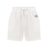 White cotton activewear shorts with a small black logo on the left leg, featuring a drawstring waistband. 100% Cotton available in Dubai same day delivery best of summer and winter casual streetwear unisex men and women shorts and t-shirts available in UAE fast delivery and same day delivery available