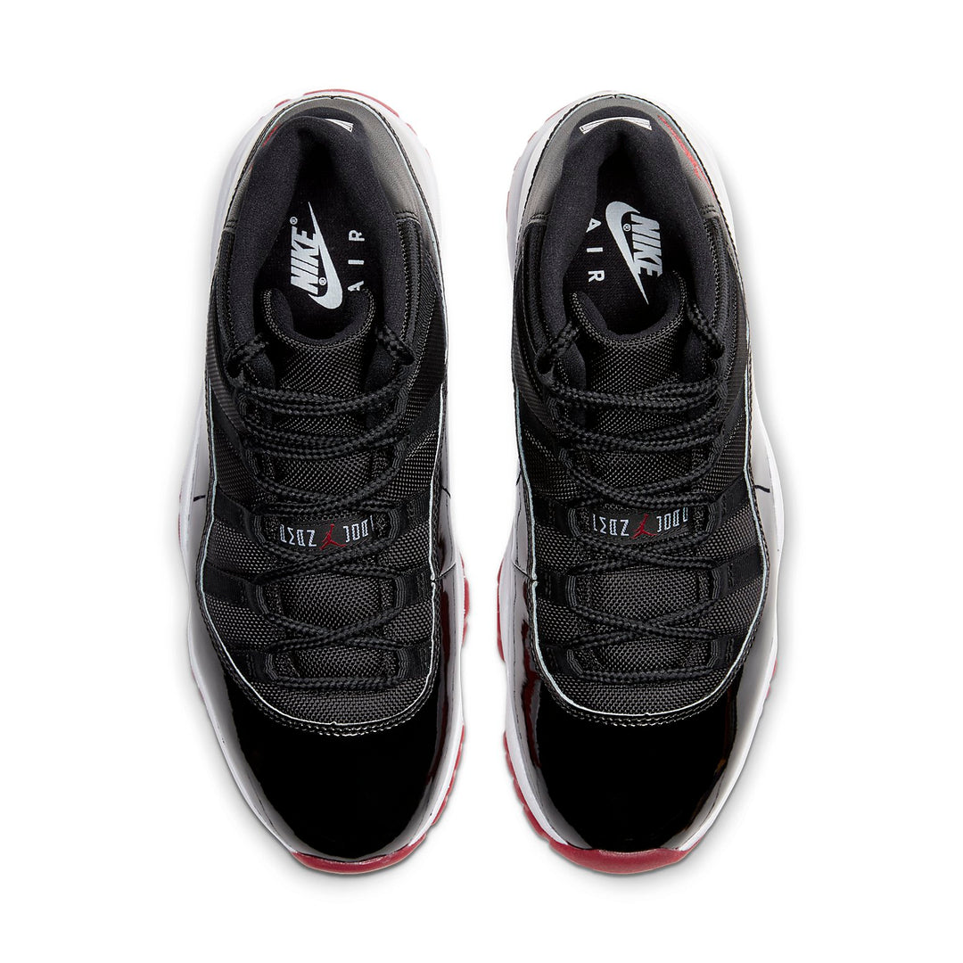 Black Nike Air sneakers with red accents on a white background. Nike shoes Jordans dunks 