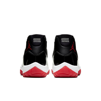 Black and red sneakers with a white sole on a white background. Nike shoes Jordans dunks 
