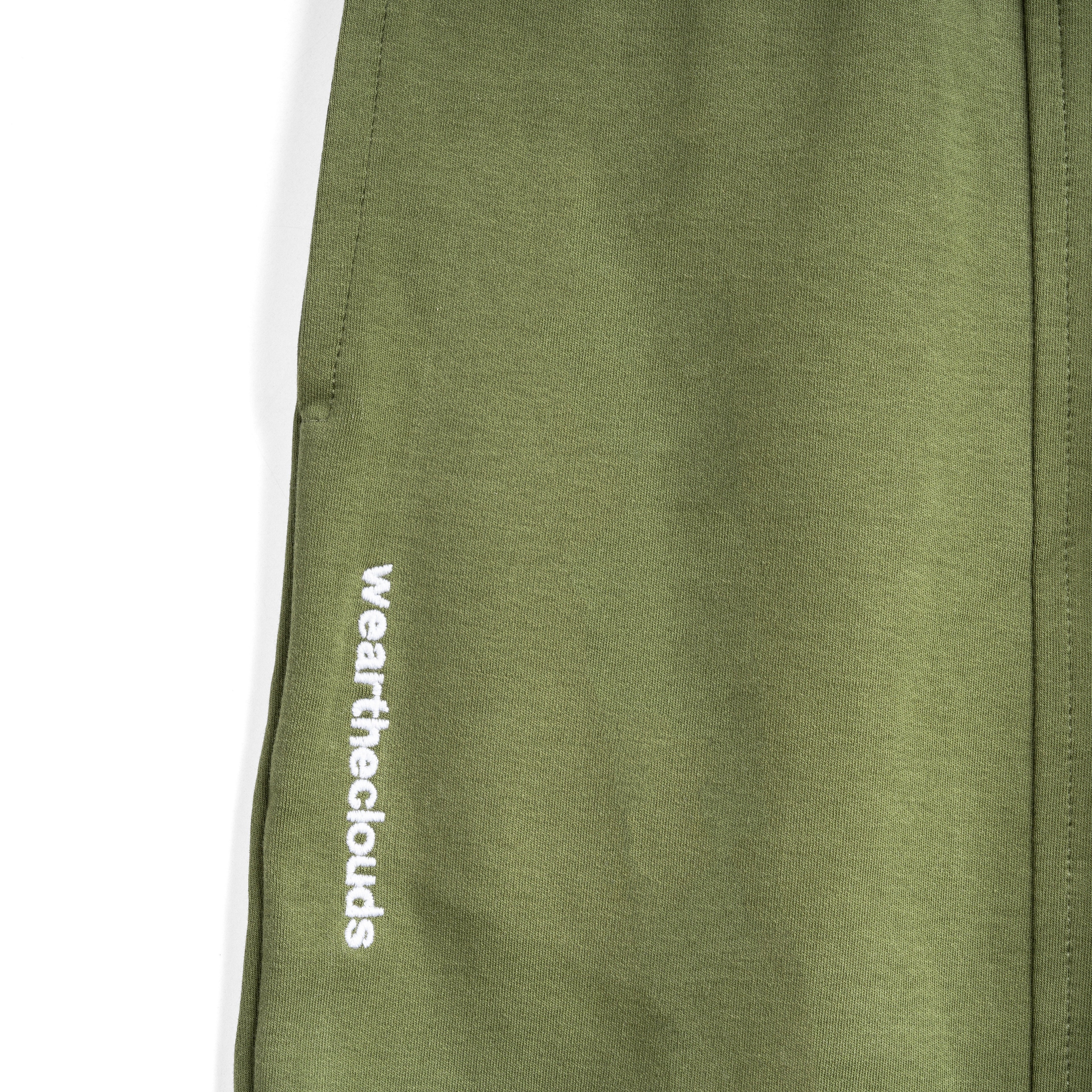 White cotton activewear pants with a small black logo on the left leg, featuring a relaxed fit and drawstring waist. 100% Cotton available in Dubai same day delivery best of summer and winter casual streetwear unisex men and women shorts and t-shirts available in UAE fast delivery and same day delivery available Pants joggers jogger pants