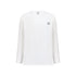 White long sleeve cotton t-shirt with a small black embroidered logo on the chest. White cotton activewear pants with a small black logo on the left leg, featuring a relaxed fit and drawstring waist. 100% Cotton available in Dubai same day delivery best of summer and winter casual streetwear unisex men and women shorts and t-shirts available in UAE fast delivery and same day delivery available Pants joggers jogger pants